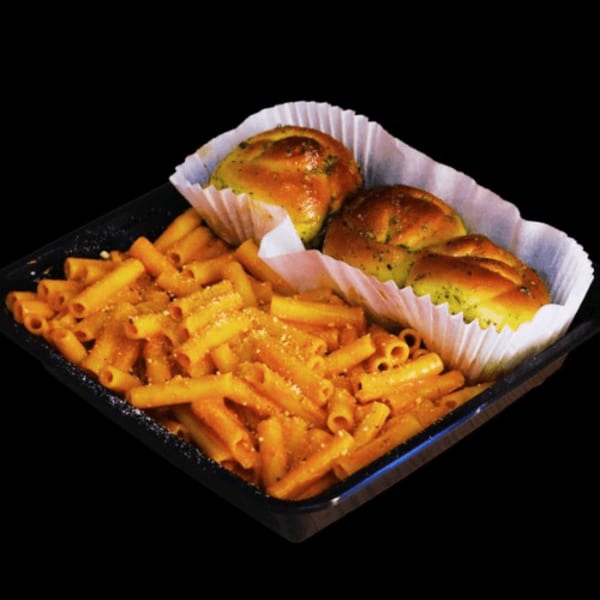 Pasta with red sauce and two garlic knots in a black takeout container from Casa Mia.