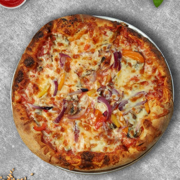 A Casa Mia pizza, topped with melted cheese, red onions, and colorful bell peppers.